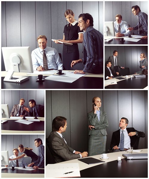 Businesspeople at computer - Stock Photo